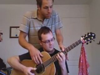 Guitare a 4 mains