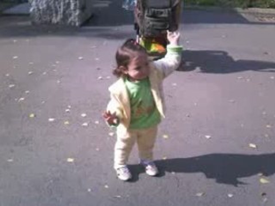 Elizabethin the park,waving  for Bye-Bye