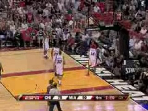 Dwyane Wade leaps right over his teammate for this block.