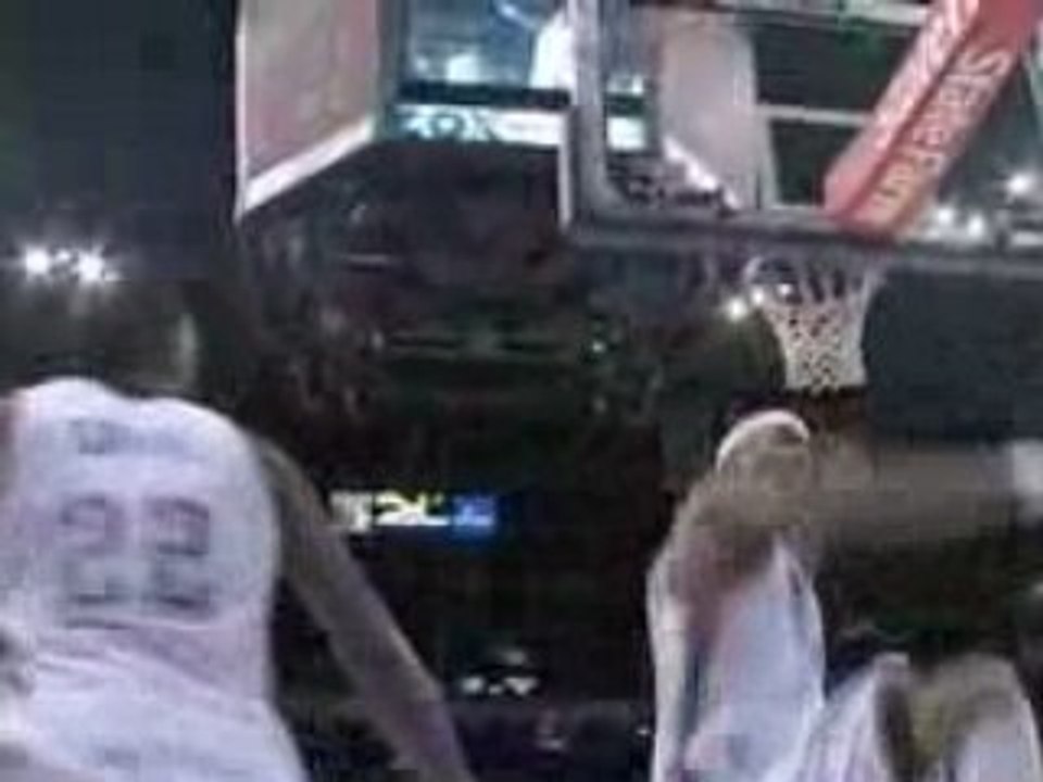 Chris Wilcox sends Marco Belinelli's shot into the stands.