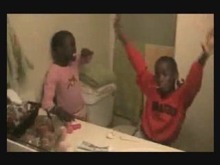 Gift and Grace brush their teeth