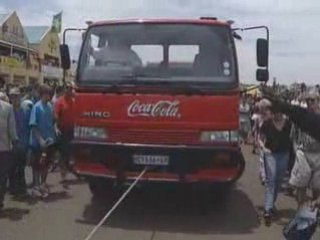 Man Pulls Six 10-Ton Trucks