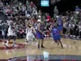 NBA Greg Oden blocks Chris Duhon's shot into the stands.