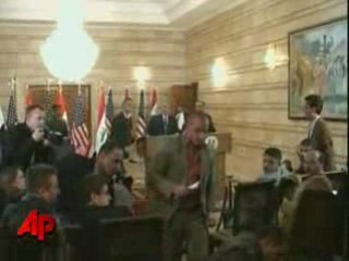 iraqi journalist throws shoes on bush