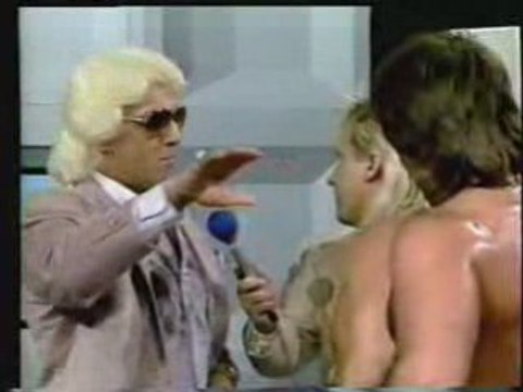 Ric Flair gives Ricky Morton a training bra