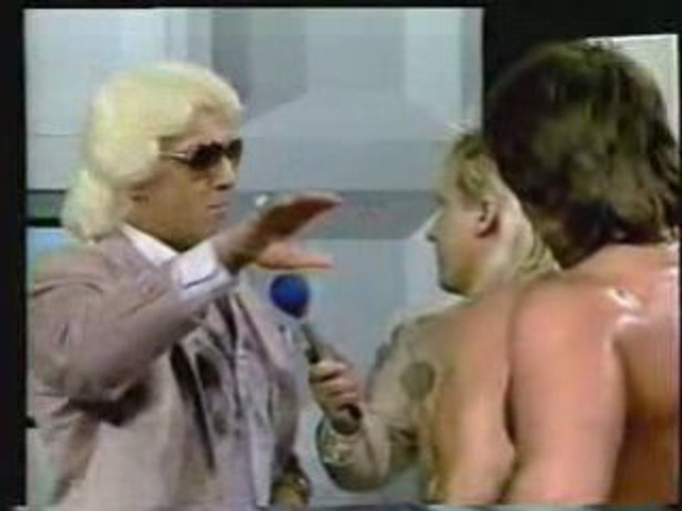 Ric Flair gives Ricky Morton a training bra