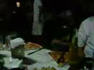 A man dancing while he singing in cafe leona