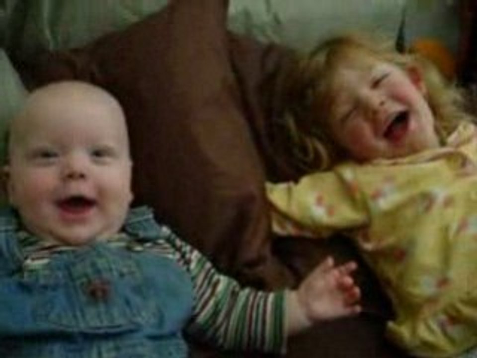 Skyler laughing on the bed