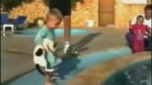Baby throws a cat in the swimming pool