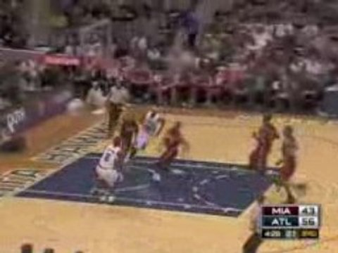 NBA Dwyane Wade rejects Joe Johnson's slam dunk attempt.