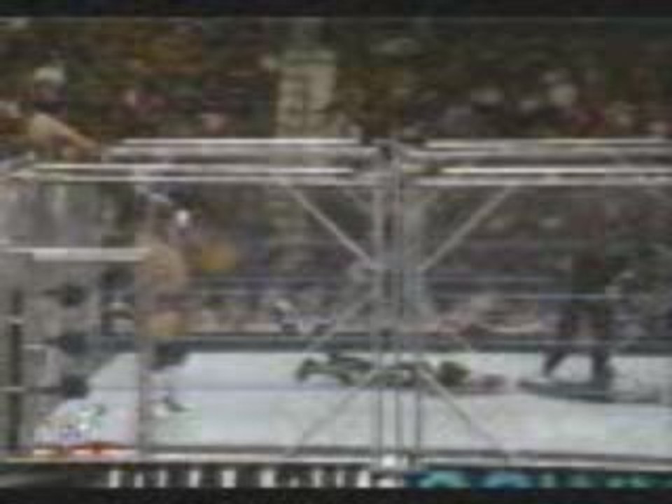 Tronch-Billy Gun backdrops Jeff Hardy over stell cage.