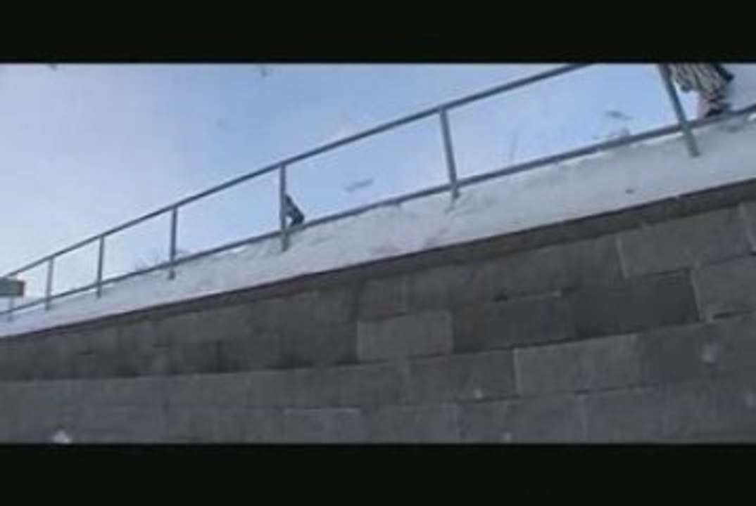 Snowboarder does a Head Grind