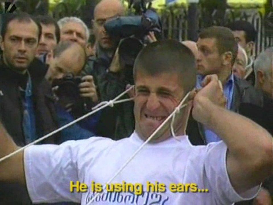 Man Pulls Minivan With Ears