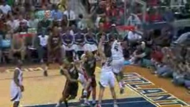 NBA J. Smooth Block swats Beasley's shot into the stands.