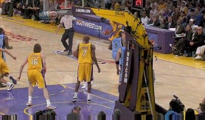 NBA Kobe Bryant's tripped by the referee but he stays on his