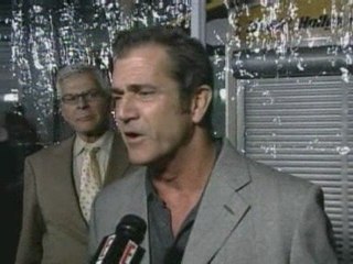 Mel Gibson shows off new girlfriend at Wolverine premiere