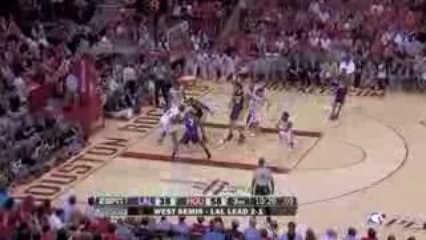 Chuck Hayes blocks Trevor Ariza during the third quarter of