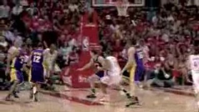 Kyle Lowry dishes to Carl Landry who drives the baseline for