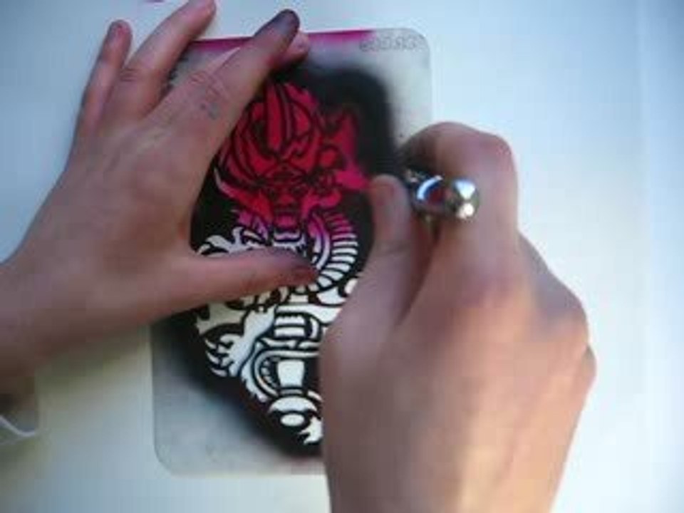 Spraying an airbrush tattoo Dragon