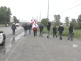Caledonia residents march past DCE with Canadian flags